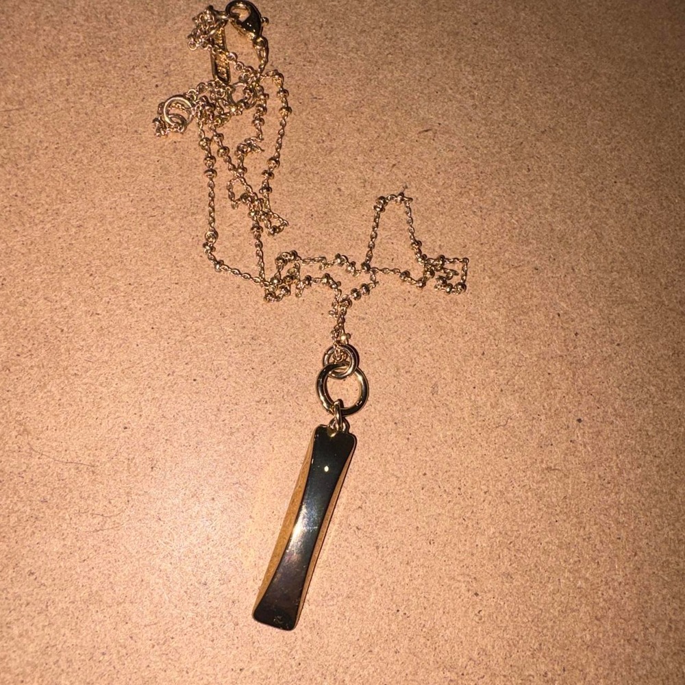Nine West Gold pendant necklace with a long chain and a rectangular pendan